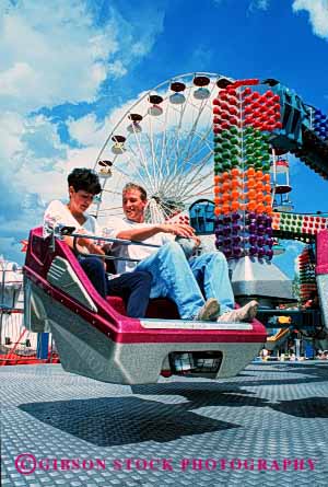 Stock Photo #2832: keywords -  affection amusement couple fun husband intimate park play released ride share summer sun sunshine thrill together travel vert wife