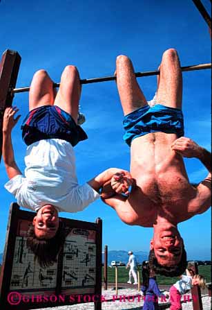 Stock Photo #2833: keywords - affection couple different down exercise fun funny hand hold husband intimate inverse play released reverse share side strange summer sun sunshine together travel unusual up vert wife workout