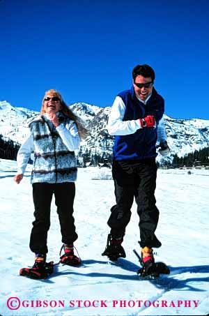 Stock Photo #2835: keywords -  affection alone couple fun husband intimate laugh play private released run share smile snow snowshoe solitude sun sunshine together vacation vert wife winter