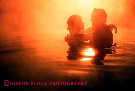 Stock Photo #2850: keywords -  affection alone close couple fog fun heat horz hot hug husband intimate orange play private released share silhouette solitude spa steam summer sun sunshine together travel vapor wife yellow
