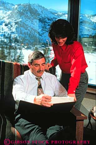 Stock Photo #3456: keywords - boss business commerce cooperate couple couples document hotel partner released report review room secretary share team transaction travel vert