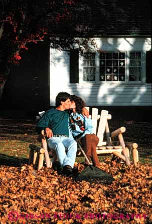 Stock Photo #2851: keywords -  affection autumn couple fall home house husband intimate kiss leaves love outdoor rake released share together vert wife