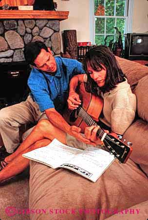 Stock Photo #2854: keywords -  affection coordinate couple guitar husband instrument intimate learn listen love music noise practice released share sound string teach team together vert wife