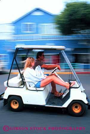 Stock Photo #2860: keywords -  affection blur cart couple drive fun golf husband intimate love motion movement relax released share summer together travel vacation vehicle vert wife