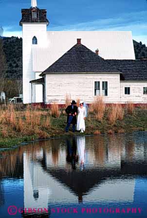 Stock Photo #2865: keywords -  affection bride church couple dress groom husband intimate love old reflection released share style together vert wedding western wife