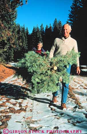 Stock Photo #3458: keywords -  adventure christmas citizen cooperate couple couples cut elderly exercise harvest hike holiday mature outdoor released senior share snow together tree vert walk winter