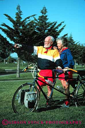 Stock Photo #2881: keywords -  active bicycle bicycling bike biking couple elderly exercise fitness grandparent health husband mature recreation released senior share sport tandem team together vert wife workout