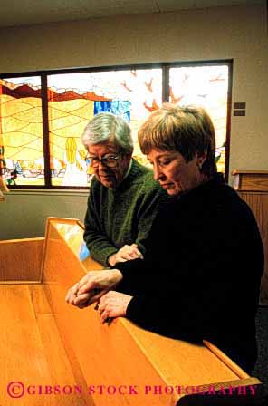 Stock Photo #2892: keywords -  chapel church couple elderly grandparent husband mature pray released religion senior share team together vert wife