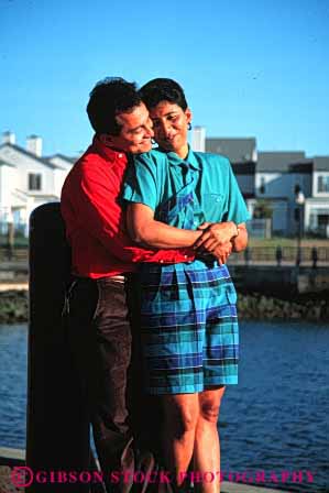 Stock Photo #2894: keywords - affection chicano colorful couple hispanic hug husband intimate love mexican minority released share smile together vert wife