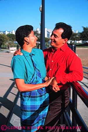 Stock Photo #2895: keywords -  affection chicano colorful couple hispanic husband intimate love mexican minority released share smile together vert wife