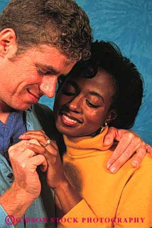 Stock Photo #2899: keywords -  affection african american black caucasian couple ethnic home hug husband interracial intimate love man minority mixed released share together vert wife woman