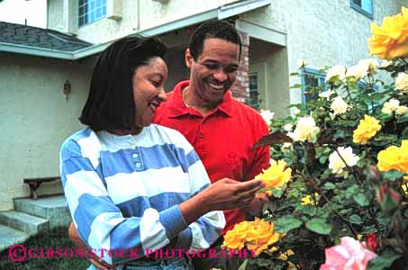 Stock Photo #2902: keywords -  african american black couple flowers home horz husband intimate minority released residential share smell summer together wife