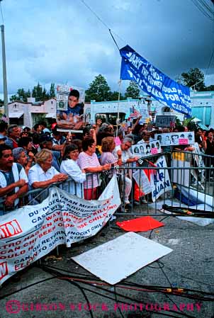 Stock Photo #6173: keywords -  attitude banner banners barricade demonstrate demonstrators elian express gonzalez home influence miami opinion out outspoken protest public sign signs speak together unite united vert