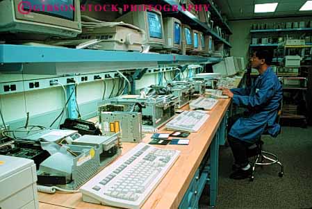 Stock Photo #2934: keywords -  asian assembly bench computer control employee factory horz job keyboard labor laboratory manufacturer minority monitor occupation quality station technical technology testing work