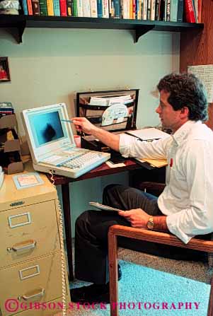 Stock Photo #2937: keywords - business casual compute computer data equipment home laptop man office portable process released technology vert