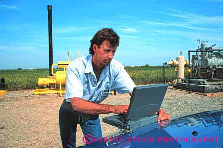 Stock Photo #2941: keywords -  battery business casual compute computer computers data equipment field horz industrial laptop man outdoor outdoors outside portable powered process released remote site technician technology using