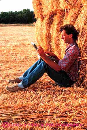 Stock Photo #2942: keywords -  agriculture alone bale battery business casual compute computer computers concentrate data equipment farm farmer field in laptop man outdoor outside peaceful people person portable powered process quiet relax released remote solitude straw technology using vert