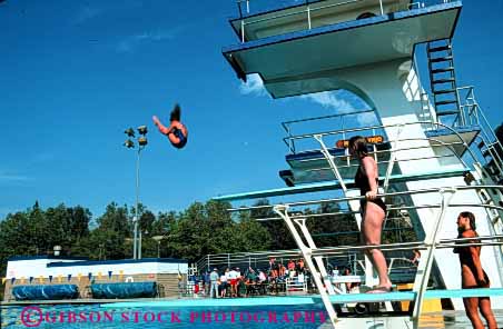 Stock Photo #2962: keywords -  athlete diver diving horz platform pool practice sky somersault sport springboard swim swimming water wet