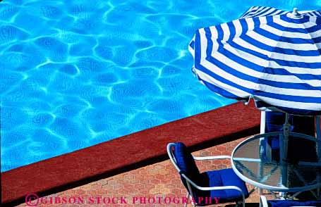 Stock Photo #2963: keywords -  chair destination horz pool relax shade swim swimming travel umbrella water wet