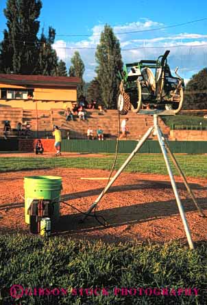 Stock Photo #2970: keywords -  accurate baseball dependable equipment industry machine mechanical moving parts pitching predict repeat technology throw tripod vert