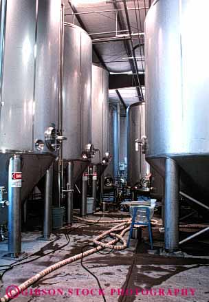 Stock Photo #2971: keywords - beer brew clean distill equipment hose industry machine mechanical micobrewry moving parts stainless steel tanks technology vert