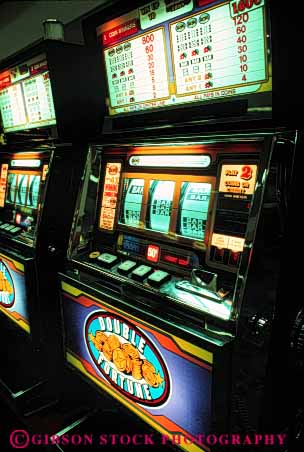 Stock Photo #2976: keywords -  armed bandit bet bright casino chance gamble gambling game loose machine neon odds one risk slot vert win