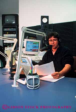 Stock Photo #3002: keywords - air announcer audio broadcast disk dj employee equipment hear income job jockey language man media occupation profession public radio released sound speak studio technology telecommunicate vert waves word work