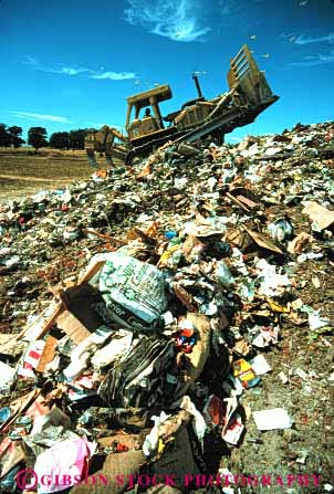 Stock Photo #3008: keywords -  disposal dispose dump effluent environment garbage landfill solid tractor trash vert waste