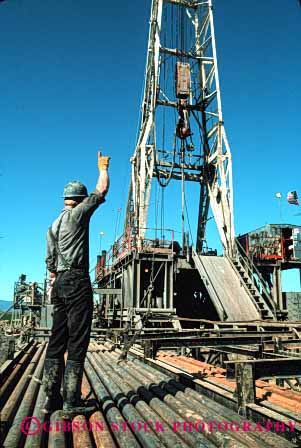 Stock Photo #3041: keywords - dirt drill drilling employee hard hardhat industry job labor man not oil outdoor physical released rig vert work workin working