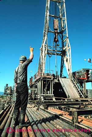 Stock Photo #3041: keywords -  dirt drill drilling employee hard hardhat industry job labor man not oil outdoor physical released rig vert work workin working