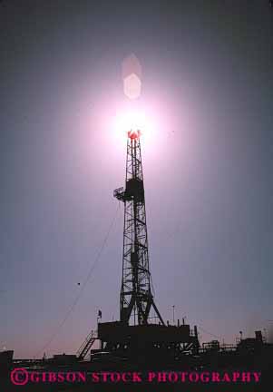 Stock Photo #3042: keywords -  drill drilling industry oil rig silhouette tall tower vert