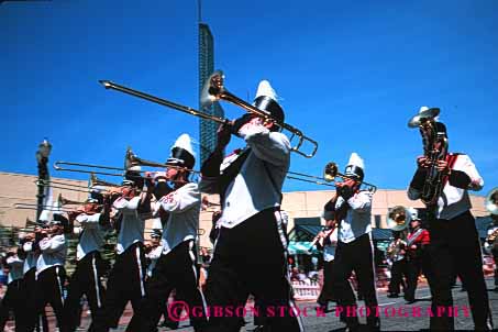 Stock Photo #3076: keywords -  band celebrate colorful coordinate horz marching move music musician noise not parade performance practice released row show sound team together trombone uniform walk