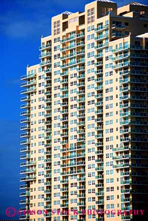 Stock Photo #6158: keywords -  angle apartment architecture balconies balcony big box building condo condominium grid lots many modern multitude patio pattern porch regular residential right shape square symmetrical symmetry tall vert window windows