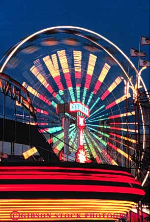 Stock Photo #3433: keywords - abstract amusement exposure lighting motion neon night ride rotation time vert