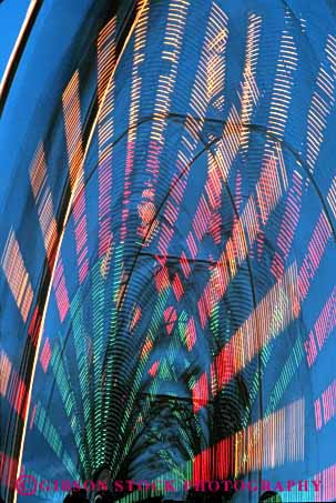 Stock Photo #3111: keywords - abstract architecture blur bright color colorful design dusk dynamic ferris geometric geometry lighting motion move movement pattern rotating vert wheel