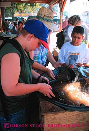 Stock Photo #3173: keywords -  activity amusement annual attraction boy boys california children event fair family festival fun gold kid kids pan panning pans park parks people person play public recreation sacramento state summer vert