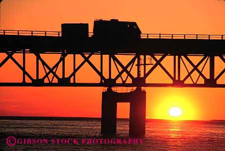 Stock Photo #3198: keywords -  bridge convenient drive highway home horz large motor motorhome recreational rv silhouette sunset trailer travel vacation vehicle