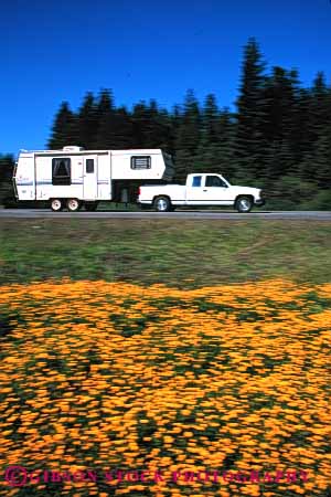 Stock Photo #3211: keywords -  blur camp camper convenient dynamic highway motion movement pick pull recreational rv tow trailer travel truck up vacation vehicle vert