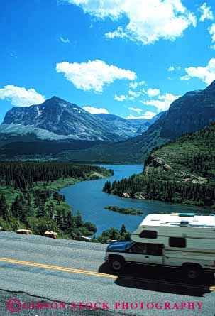 Stock Photo #3213: keywords -  blur camp camper convenient glacier highway montana motion movement national park pick recreational rv travel up vacation vehicle vert