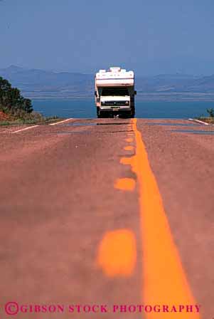 Stock Photo #3216: keywords -  camp camper convenient highway line pavement recreational rv street travel vacation vehicle vert yellow