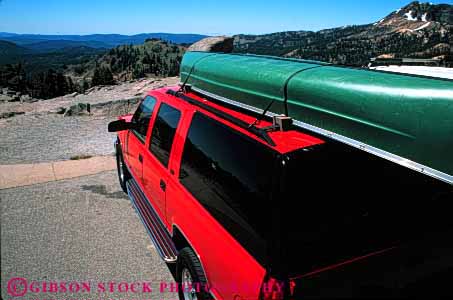 Stock Photo #3230: keywords -  camp camper canoe convenient highway horz recreational red rv sport travel utility vacation vehicle