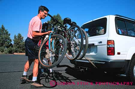 Stock Photo #3233: keywords -  auto bicycle bike bikes car carry drive four horz man rack recreational released sport suv utility vehicle wheel