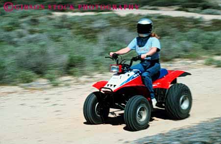 Stock Photo #3242: keywords -  all atv auto blur car drive engine frame helmet horz machine motion movement off orv recreational road terrain vehicle woman