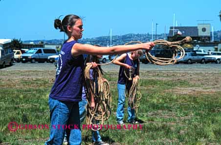 Stock Photo #4008: keywords -  activity adolescent children club cooperate craft female girl group heaving horz learn line mariner practice rope scout scouts skill summer team teenage throw together
