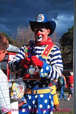 Stock Photo #4021: keywords -  act clowns color colorful costume fun hair makeup men perform play pretend show smile vert