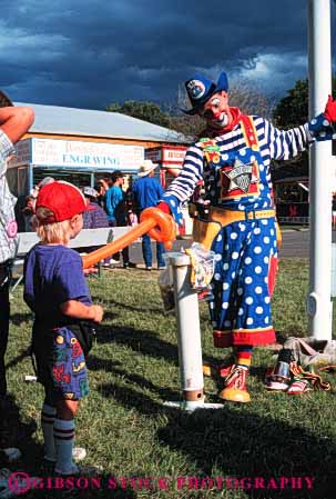 Stock Photo #4020: keywords -  act balloon boy child children clown color colorful costume fun make makeup perform play pretend show smile vert