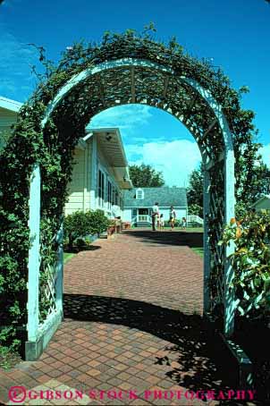 Stock Photo #4041: keywords -  arch decorate design entry exterior flower home house landscape lawn path residential trellis vert yard