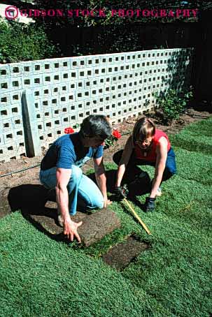 Stock Photo #4063: keywords - accomplish backyard build cooperate couple decorate design garden gardening grass green home house improvement labor landscape lawn lay outdoor released share sod team together vert work yard