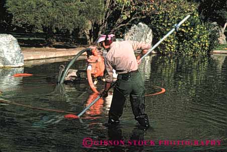 Stock Photo #4066: keywords -  clean crew employee equipment filter garden gardeners gardening groom horz job labor lake landscape landscaping maintenance pond suction team trim vacuum water work yard