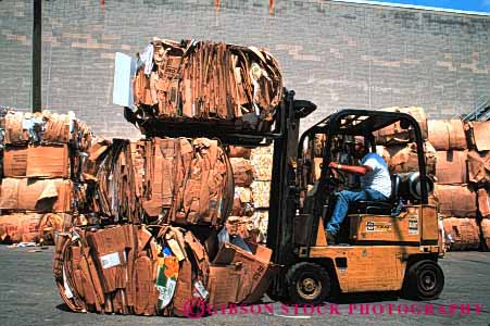 Stock Photo #4089: keywords - bale cardboard compact compress equipment fork heavy horz industry lift machine material recycle recycling resource reuse site station